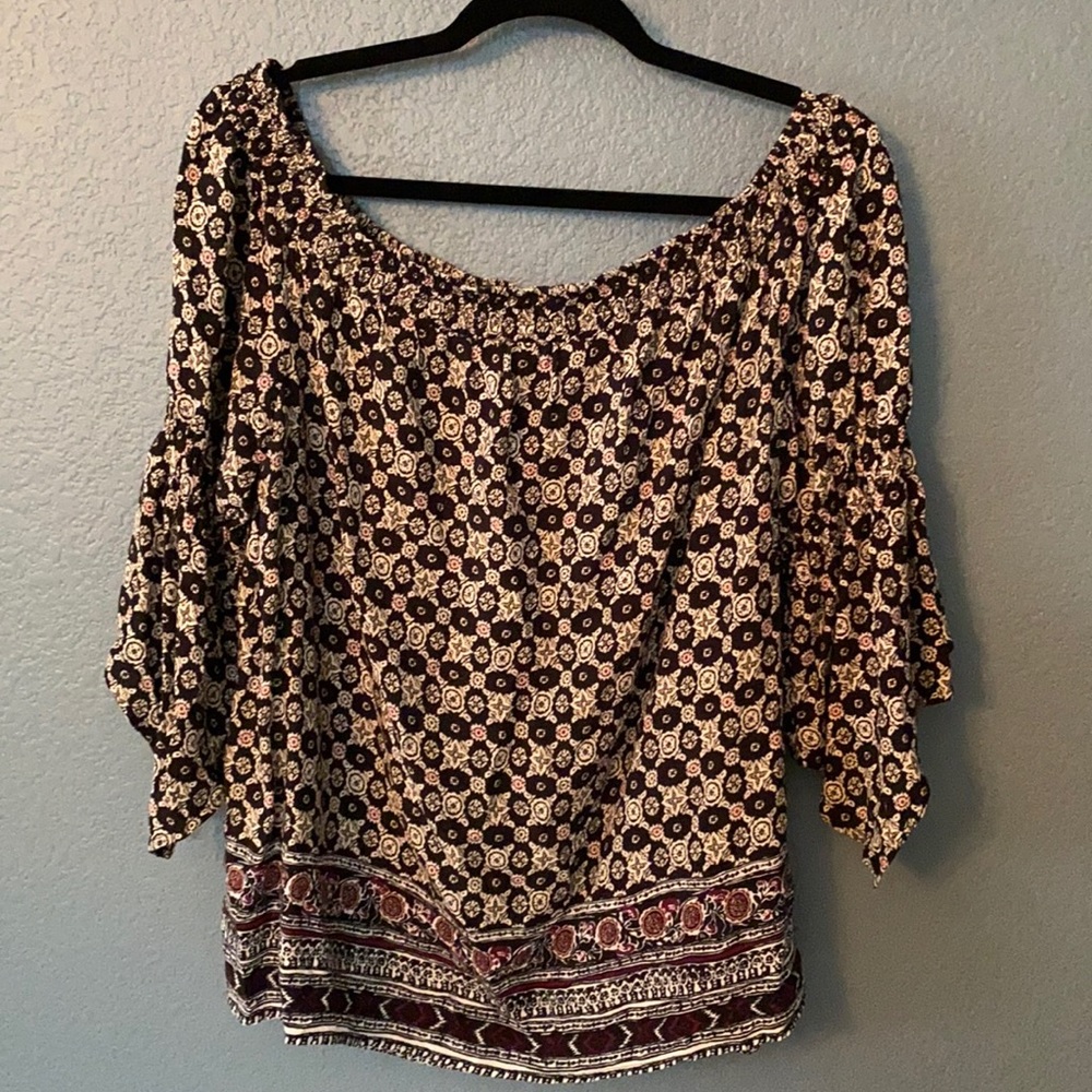 Star print black with burgundy blouse.